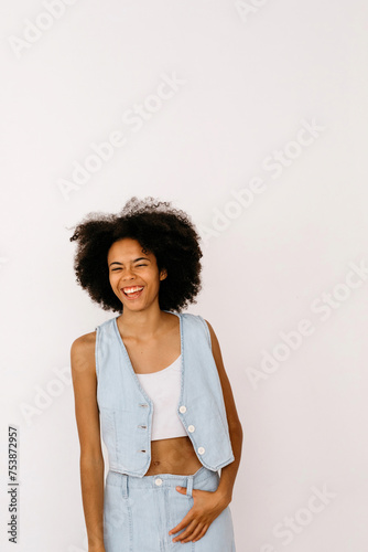 Cheerful laughing mixed race female with Afro hair