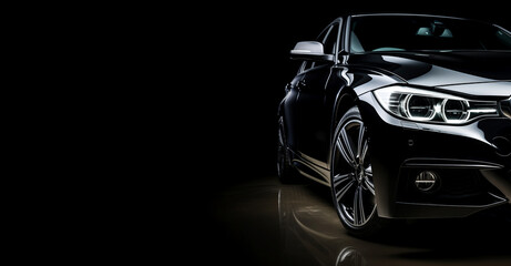 Black generic and unbranded sport car isolated on a black background with copyspace