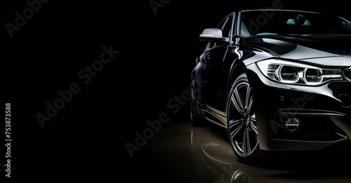 Black generic and unbranded sport car isolated on a black background with copyspace
