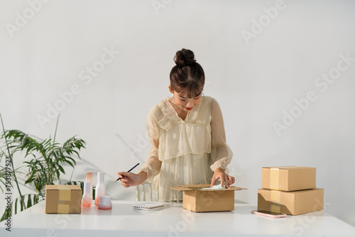 Small business owner checking product stock photo
