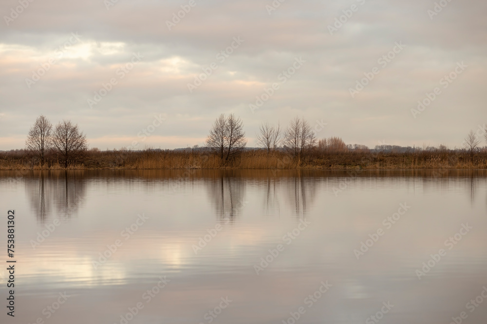 a large lake in winter in the morning during sunrise a large lake in winter in the morning during sunrise