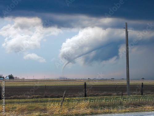 Canvas Print Distant tornado swirls up a funnel of dust in Pella, Iowa