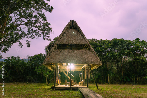 Jungle Wooden Cabin at Night