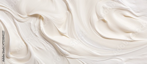 This close-up view showcases a white cream texture with numerous stunning marks on a creamy background. The intricate details of the paint create a visually interesting pattern.