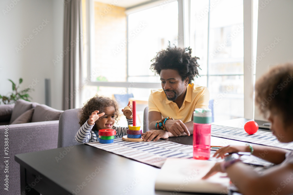 Father Together With His Daughters At Home