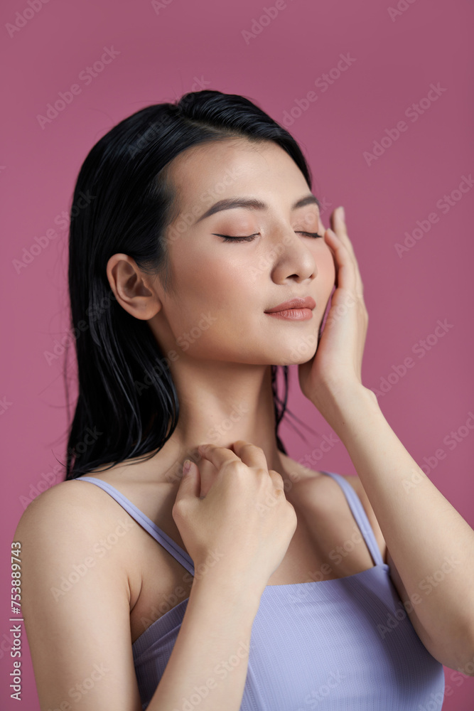Smiling asian woman touching healthy skin portrait Smiling asian woman touching healthy skin portrait