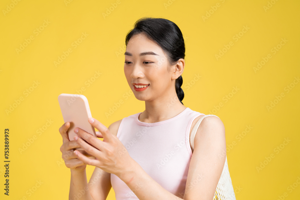 Portrait of a beautiful Asian young sporty woman using smart phone. Portrait of a beautiful Asian young sporty woman using smart phone.