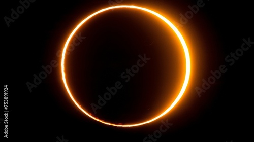  a black background with a bright orange ring of light in the center of the circle and a black background with a bright orange ring of light in the center of the circle.
