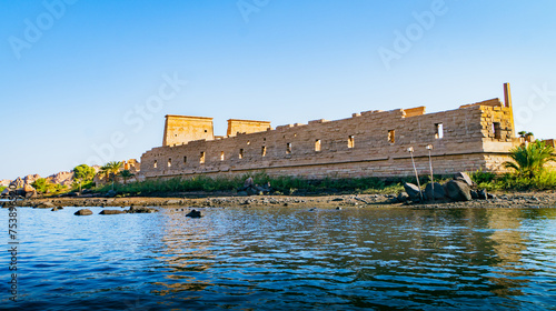 Philae Temple:  approaching by boat the temple dedicated to Isis, an enchantress known as the giver of life, the protector of kings and the mother of God 
