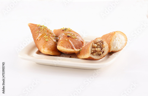 qatayef Ramadan Traditional Sweets plate on white background photo