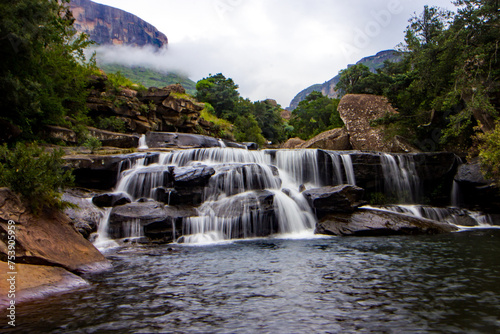The Mahai cascades in the early morning, with the Drakensberg Mountains shrouded in mist in the background photo