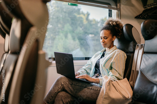 A woman travels by train photo