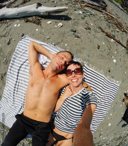 Happy Couple Toether in Love on Summer Beach photo