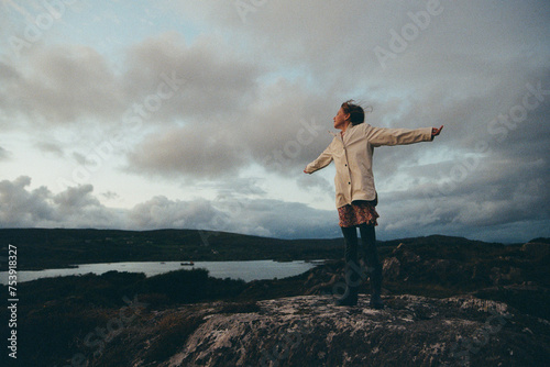 A girl  in the scenic landscape photo