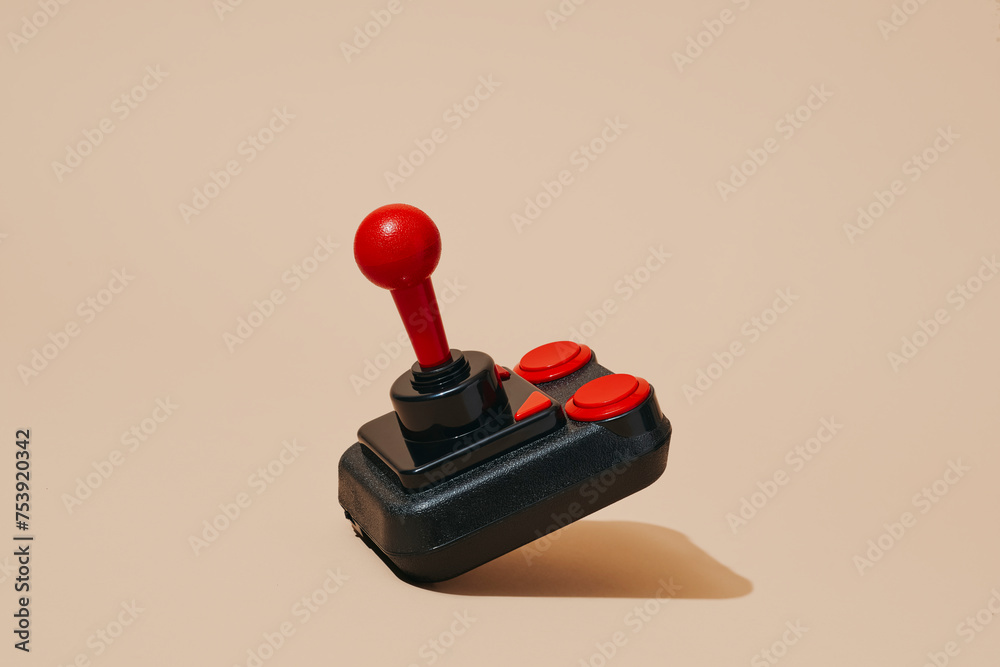 joystick on a pale pink background joystick on a pale pink background