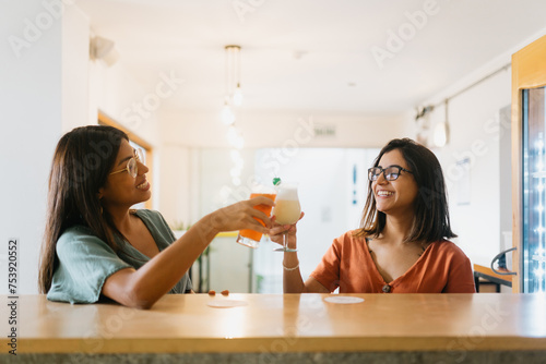 Friends enjoying their cocktails photo