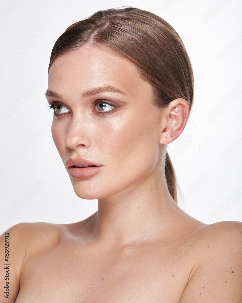 Beautiful portrait of a girl with makeup on a white background Beautiful portrait of a girl with makeup on a white background