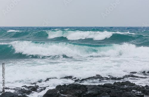 Close-up of big waves on the shore. photo