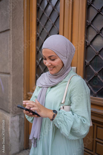 Muslim Woman on her Phone photo