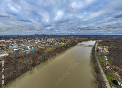 Sayre, PA, USA - 03-03-2024 - Cloudy winter aerial image of Chemung River near downtown area in the City of Sayre, PA.  photo