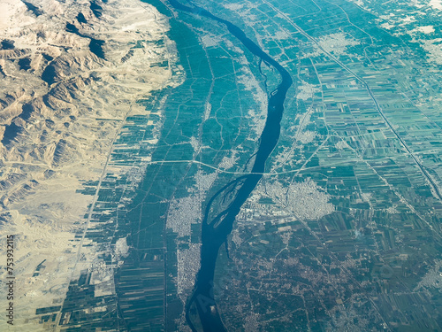 aerial landscape view of city's Qus and Al Khttarah in Qena district in Egypt, located at river Nile