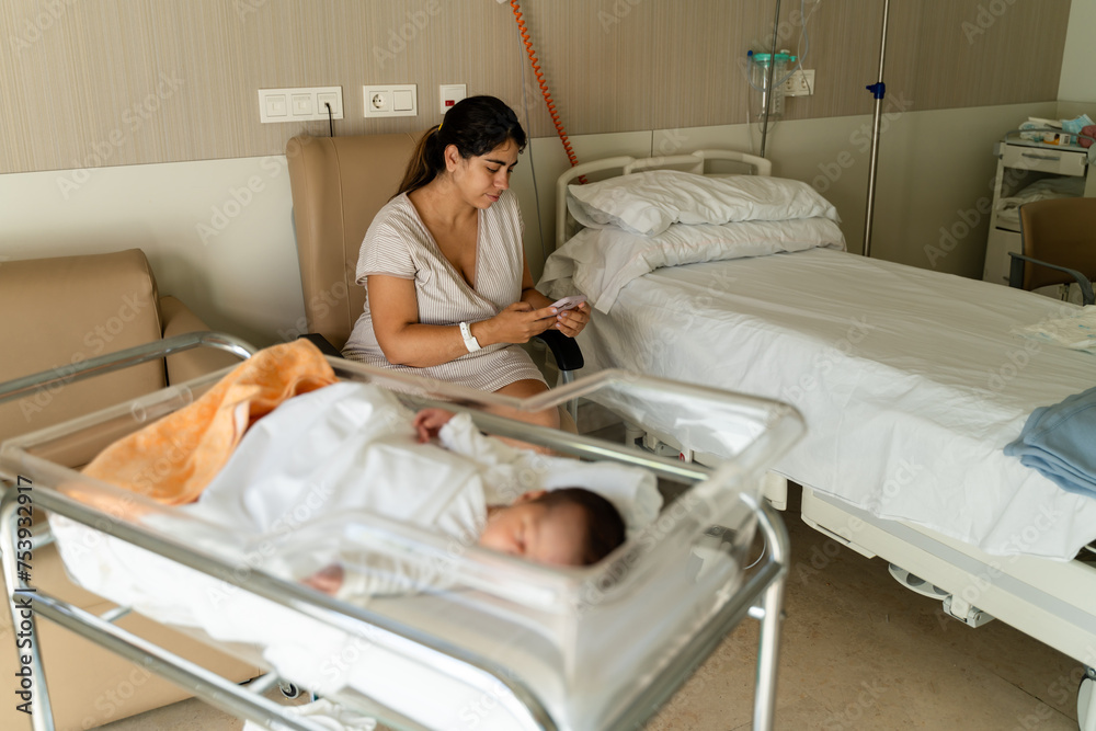 Woman using mobile phone in hospital. Woman using mobile phone in hospital.