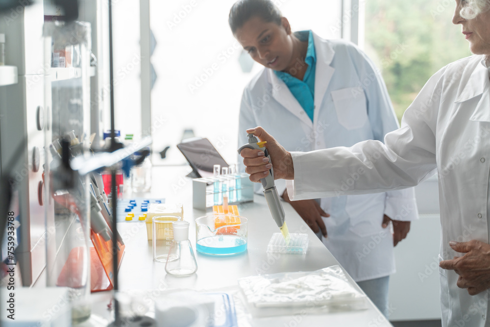 People Working In Luminous Modern Laboratory People Working In Luminous Modern Laboratory