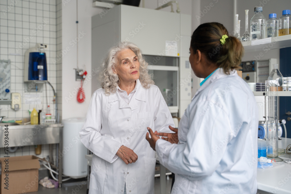 Two Scientists Conversation In Laboratory Two Scientists Conversation In Laboratory