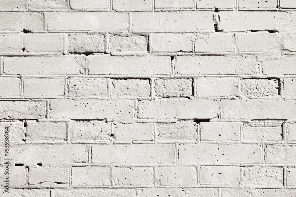 Fototapeta premium White paint brick wall background. Outdoor house facade texture. Gray vintage block structure. Old architecture background. Grunge weathered cracked texture.