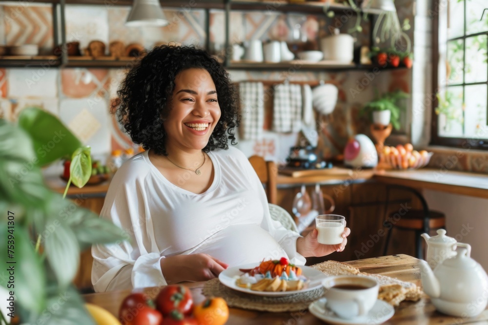 A cheerful pregnant woman enjoys a nutritious breakfast, her smile reflecting the cozy and nurturing atmosphere of her plant-adorned kitchen. A cheerful pregnant woman enjoys a nutritious breakfast, her smile reflecting the cozy and nurturing atmosphere of her plant-adorned kitchen.