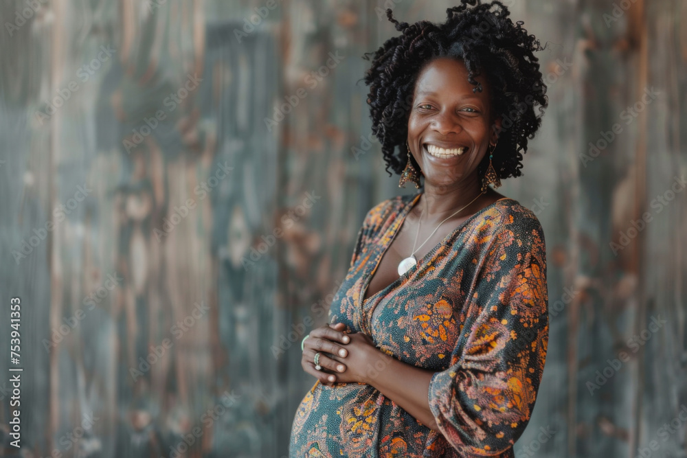 A beaming pregnant African woman, adorned in a floral print dress, celebrates her journey to motherhood against an artistic backdrop. - obrazy, fototapety, plakaty 