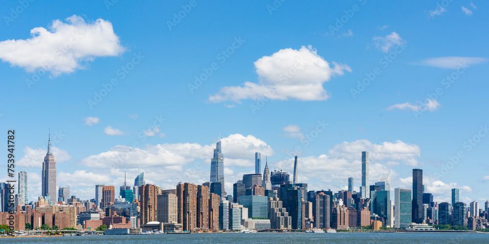 © Kristin Duvall/Stocksy - Midtown Manhattan skyline. New York City. © Kristin Duvall/Stocksy - Midtown Manhattan skyline. New York City.