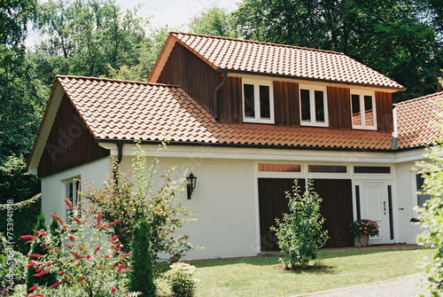 german house in summer with landscaping photo