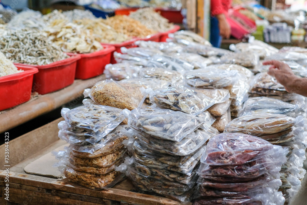 Fototapeta premium Salted fish or dried fish is fish that is preserved by salting and drying in the sun. It is being sold at fish markets. This is a famous traditional side dish in Indonesia.