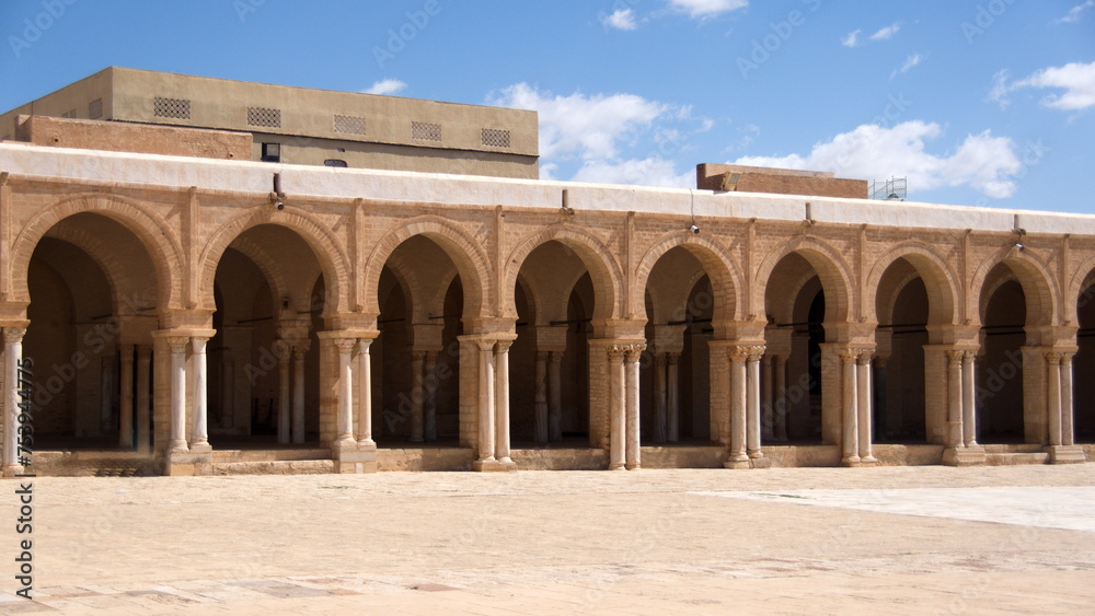 Inner courtyard surrounded by a patio supported by arches and columns in the Great Mosque of Kairouan, in Kairouan, Tunisia