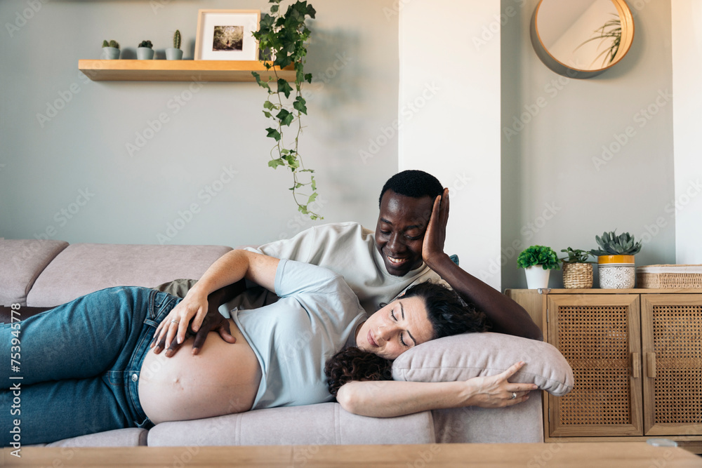 Pregnant Couple lying On The sofa Pregnant Couple lying On The sofa