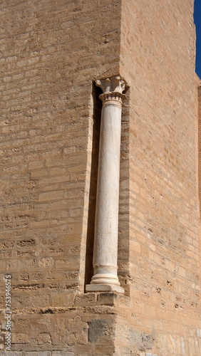 Ancient roman column on an outer wall of the Great Mosque of Kairouan, in Kairouan, Tunisia photo