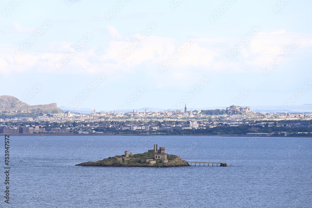Edinburgh Skyline.  A view of the Edinburgh skyline from the Firth of Forth.  The island of Inchmickery can be seen in the foreground and the castle can be seen dominating the skyline.