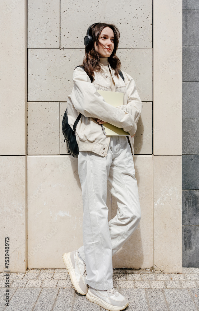 Stylish woman standing near wall Stylish woman standing near wall