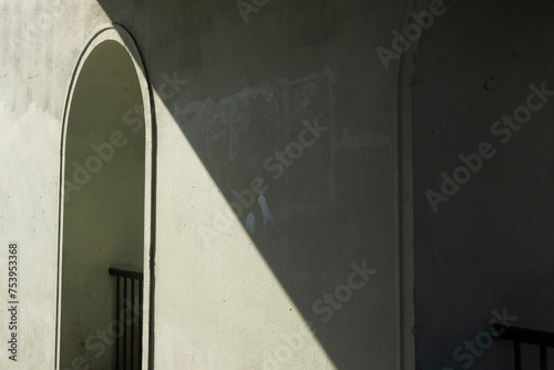 Photo of green tunnel with contractual shadow