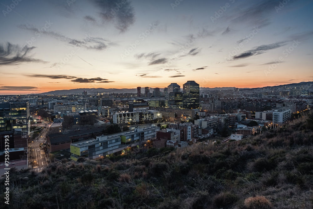 Twilight view of the south-western districts of the city of Barcelona in Spain.