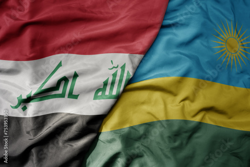 big waving national colorful flag of rwanda and national flag of iraq.