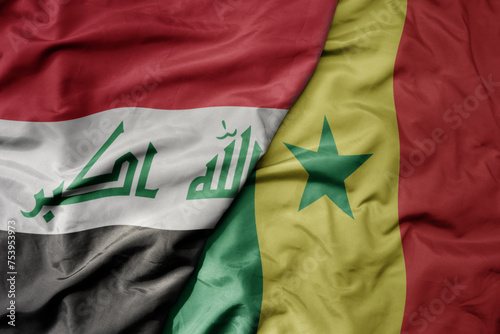big waving national colorful flag of senegal and national flag of iraq.