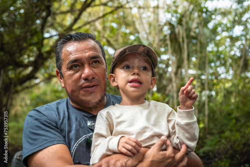 Happy father and son in nature photo