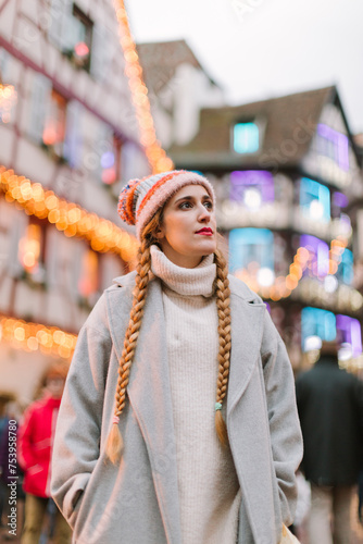 A woman in a Christmas village