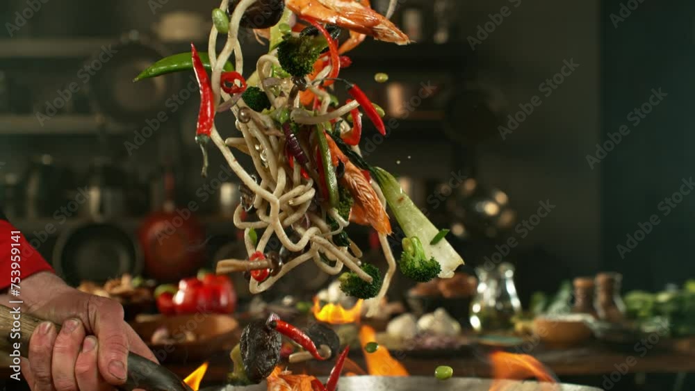 Super slow motion of flying asian wok noodles with prans and vegetable. Filmed on high speed cinema camera, 1000 fps. Speed ramp effect. Super slow motion of flying asian wok noodles with prans and vegetable. Filmed on high speed cinema camera, 1000 fps. Speed ramp effect.