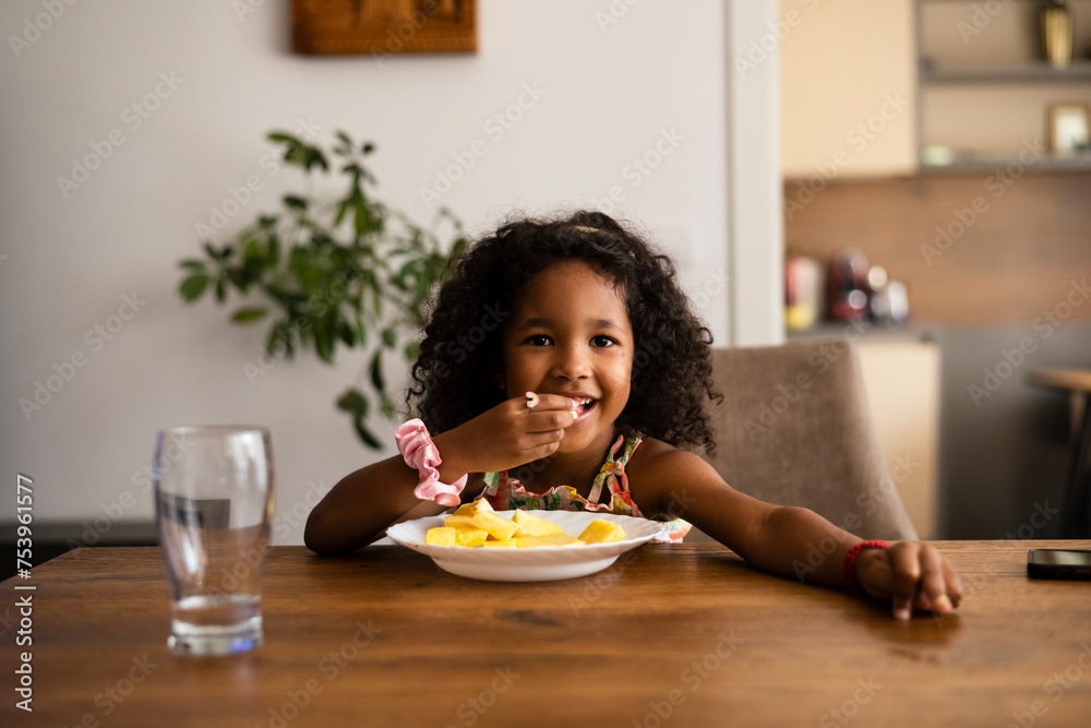 Girl eating pineapple
