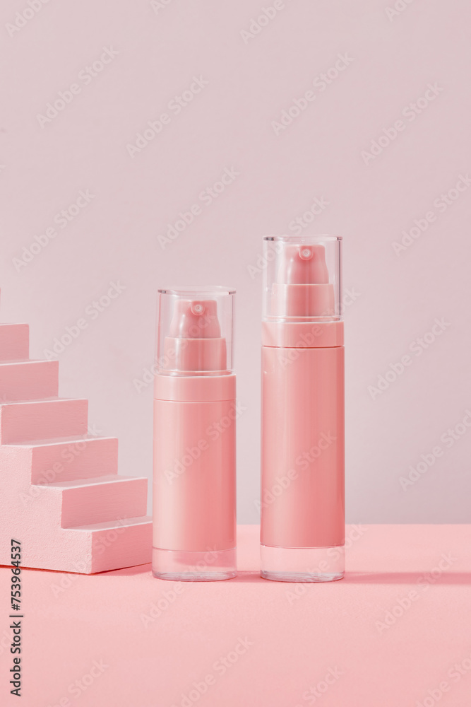 Skin care lotion bottles on pink background Skin care lotion bottles on pink background