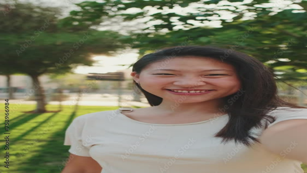 Young woman smiling looking at the camera taking selfie Young woman smiling looking at the camera taking selfie