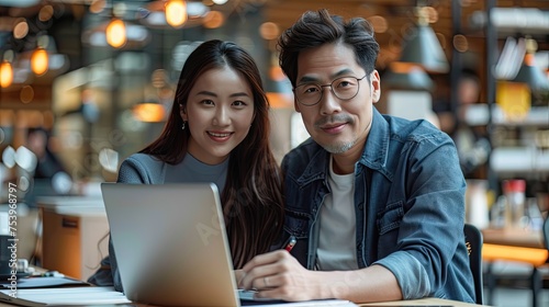 two asian businesspeople working at office 